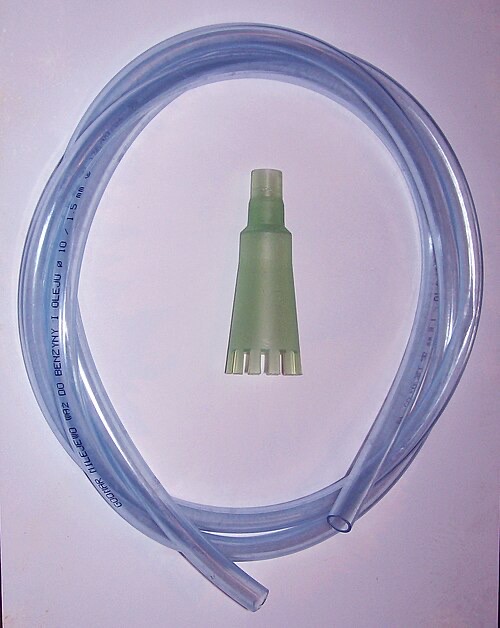 A gravel vacuum: a wide tube on a hose. Push it into the gravel and it siphons out dirt with the water.