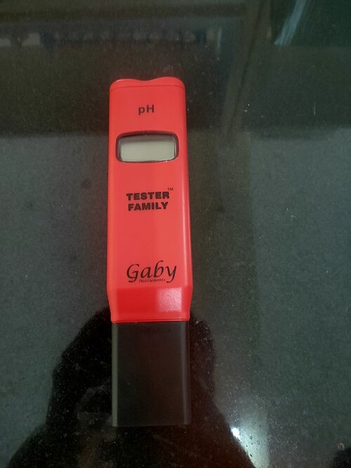 A pen-style digital pH tester. Dip it in tank water and read the number; calibrate it regularly.