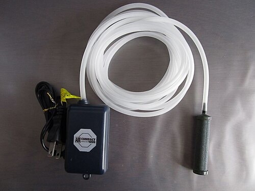 An air pump, tubing and airstone. A battery-powered version of this is the key power-outage kit.