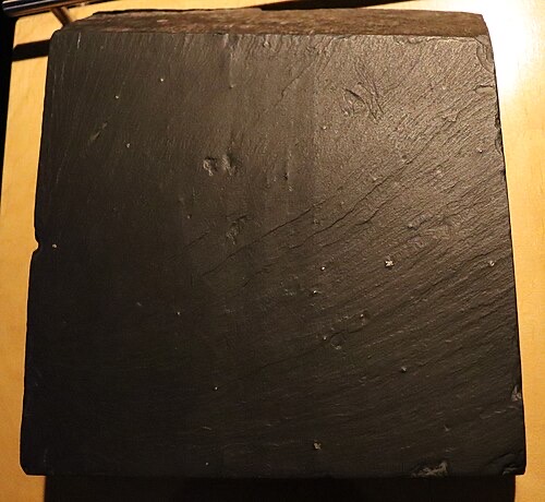 Slate is a safe, inert rock that doesn't change water chemistry.